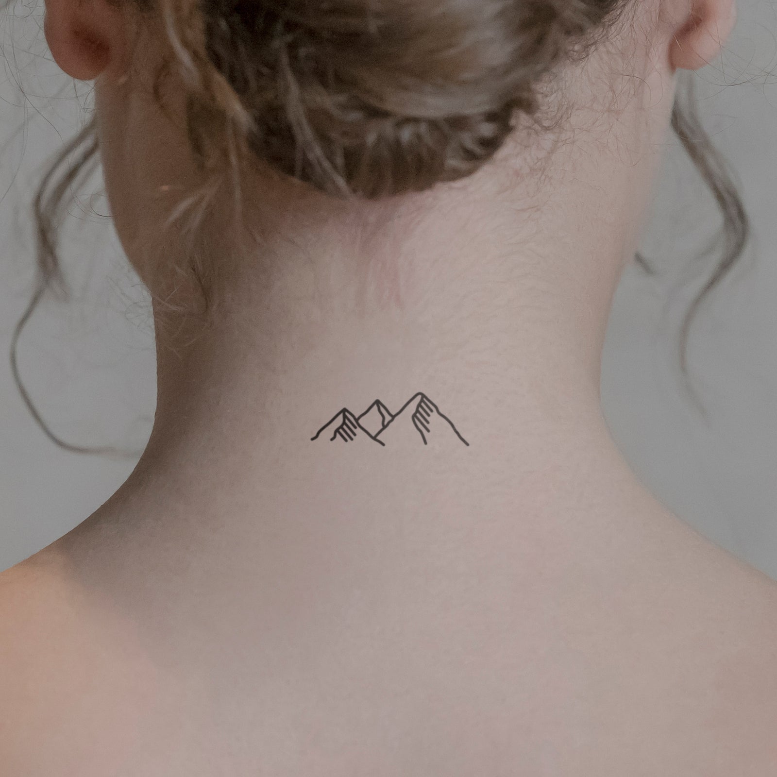 Beautiful minimal mountain tattoo by Chinatown Stropky - Tattoogrid.net